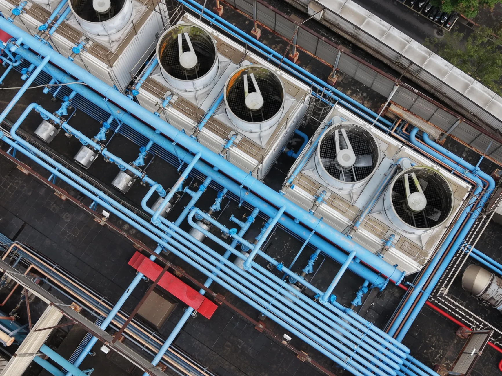 Aerial view of data center cooling towers and cooling-loop distribution piping