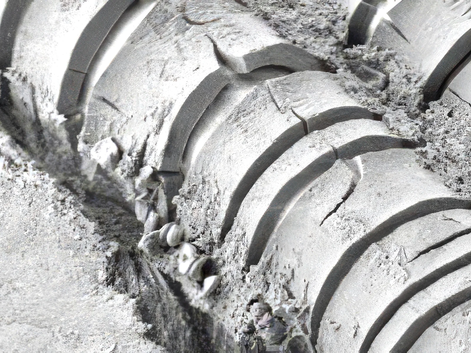 SEM micrograph of degraded polypropylene mesh fiber showing structural cracking and surface erosion from in-vivo degradation