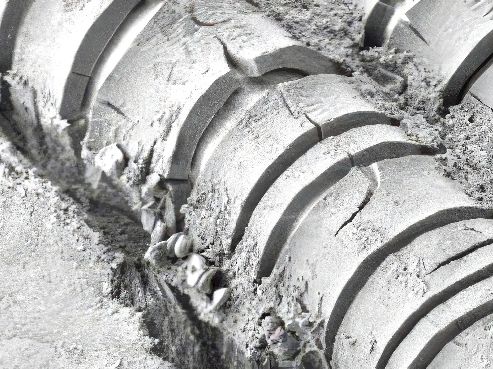 SEM micrograph of degraded polypropylene mesh fiber showing structural cracking and surface erosion from in-vivo degradation