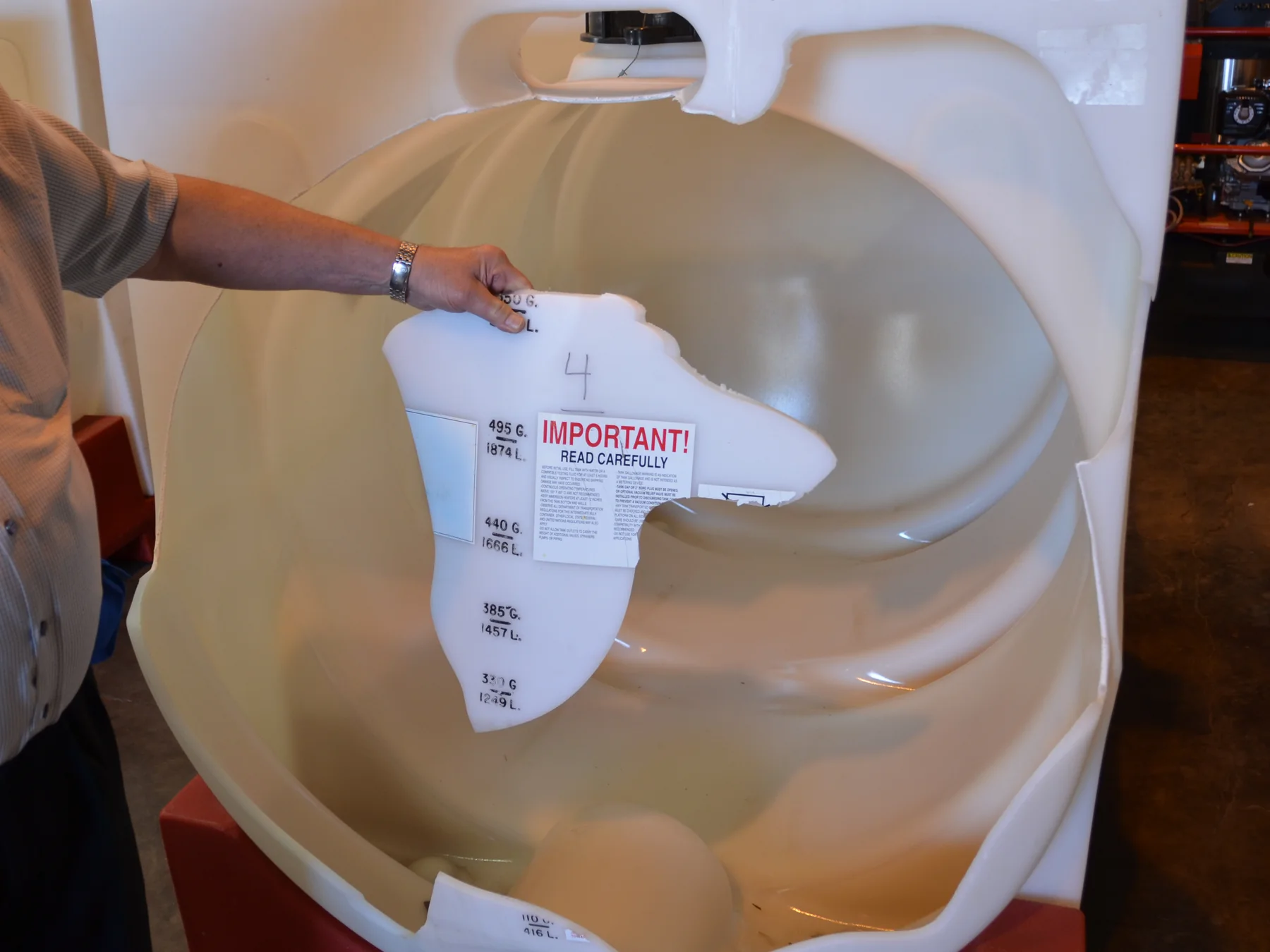 Failed polyethylene intermediate bulk container with a section removed for examination, industrial plastic expert witness analysis by Plastic Expert Group
