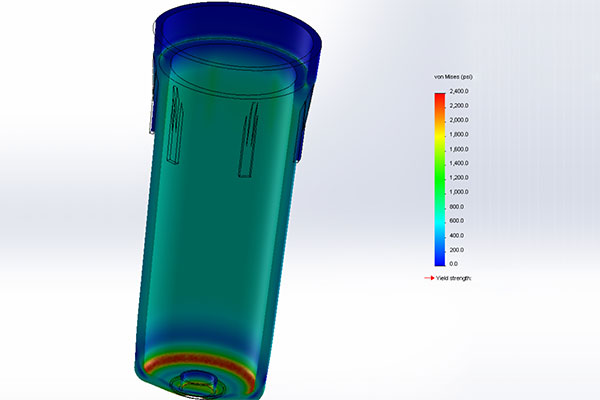 Computer model of a cylindrical water filter housing, colour mapped against a legend scale