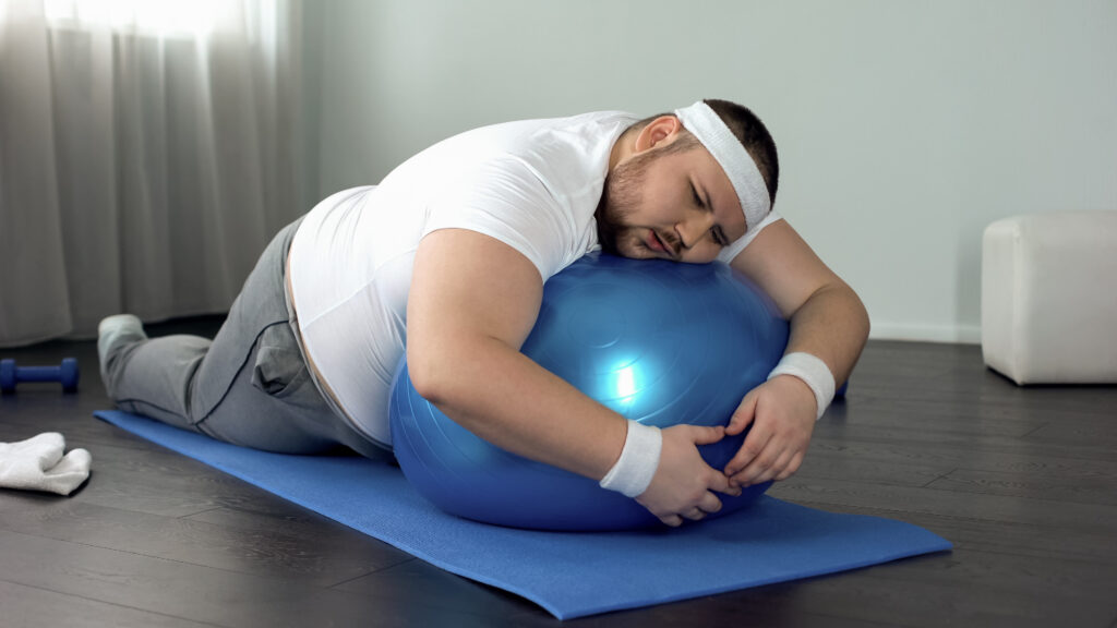 a man relaxing on a fitness ball